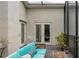 Relaxing screened patio with comfortable seating, wood deck, and natural light, perfect for outdoor living and entertaining at 1326 Moss Dr, Dunedin, FL 34698