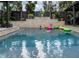This refreshing pool has inflatable toys for endless fun, perfect for summer days at 1326 Moss Dr, Dunedin, FL 34698