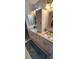 Bright bathroom features a dual granite vanity and walk-in shower at 14324 Bronte Ct, Hudson, FL 34667