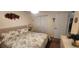 Charming bedroom featuring floral bedding, closet doors, and decorative accents at 14324 Bronte Ct, Hudson, FL 34667