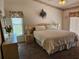 Bright and airy bedroom featuring a large bed and sliding glass doors at 14324 Bronte Ct, Hudson, FL 34667