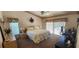 Cozy bedroom boasts a plush carpet, ceiling fan and sliders that lead to the pool area at 14324 Bronte Ct, Hudson, FL 34667