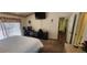 Spacious bedroom with large bed, TV, desk, and sliding glass doors at 14324 Bronte Ct, Hudson, FL 34667