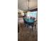 Bright dining area with a dining table set for six, and a view to the outdoor sitting area at 14324 Bronte Ct, Hudson, FL 34667