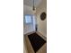 Inviting entryway with a white front door, tiled floor, and a decorative wall hanging at 14324 Bronte Ct, Hudson, FL 34667