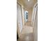 Long hallway featuring multiple closets and view to the bathroom at 14324 Bronte Ct, Hudson, FL 34667