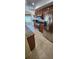 Bright kitchen with stainless steel appliances, tile floors, and wood cabinetry at 14324 Bronte Ct, Hudson, FL 34667