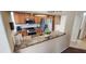 A view of the kitchen featuring granite counters, wood cabinets and stainless steel appliances at 14324 Bronte Ct, Hudson, FL 34667
