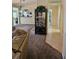 View into the living room, kitchen and hall bathroom of the home at 14324 Bronte Ct, Hudson, FL 34667