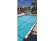 Screened pool with cool, clear water. Ideal for enjoying the outdoors in a comfortable setting at 14324 Bronte Ct, Hudson, FL 34667