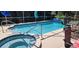 This screened-in pool and spa offers a serene retreat at 14324 Bronte Ct, Hudson, FL 34667