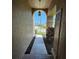 Arched walkway leading to a beautiful exterior view of the front yard and neighborhood at 14324 Bronte Ct, Hudson, FL 34667