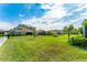 Spacious backyard with well-manicured lawn, offering privacy and ample space for recreation and relaxation at 148 Mossy River Ct, Brandon, FL 33511