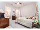 Cozy bedroom features neutral tones and classic decor for a relaxing retreat at 148 Mossy River Ct, Brandon, FL 33511