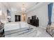 Bright bedroom with tray ceiling, an area rug, and elegant decor at 148 Mossy River Ct, Brandon, FL 33511