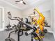 Spacious home gym complete with weight machines and an open doorway to the rest of the house at 148 Mossy River Ct, Brandon, FL 33511