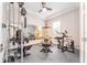 Well-equipped home gym with a mirror wall, rubber flooring, and a variety of exercise equipment at 148 Mossy River Ct, Brandon, FL 33511
