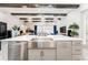 Spacious kitchen island with stainless steel sink, dishwasher, and ample storage cabinets at 148 Mossy River Ct, Brandon, FL 33511