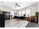 Spacious office with custom built-ins, light wood floors, and three large windows at 148 Mossy River Ct, Brandon, FL 33511