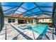 Relaxing screened-in pool and spa with brick pavers and ample lounging space at 148 Mossy River Ct, Brandon, FL 33511