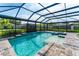 Backyard screened pool with a water feature, spa, and nice landscaping at 148 Mossy River Ct, Brandon, FL 33511