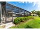 Landscaped backyard featuring a screened pool and patio, enclosed for added privacy and enjoyment at 148 Mossy River Ct, Brandon, FL 33511