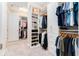 Spacious walk-in closet with custom organization, shelves, and ample storage space at 148 Mossy River Ct, Brandon, FL 33511