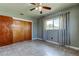 Cozy bedroom with window, closet, tile flooring, and ceiling fan at 1516 Lemon St, Clearwater, FL 33756