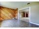 Relaxing den features an accent wall with attached shelving plus living area view at 1516 Lemon St, Clearwater, FL 33756