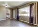 Dining room with large window, new flooring, and view to the kitchen at 1516 Lemon St, Clearwater, FL 33756