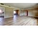 Open floor plan boasts dining and living areas with wood-look flooring at 1516 Lemon St, Clearwater, FL 33756