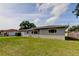 Single-story home with attached garage and a well-maintained lawn at 1516 Lemon St, Clearwater, FL 33756