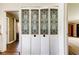 Hallway with decorative bi-fold doors that add character to the home at 1516 Lemon St, Clearwater, FL 33756