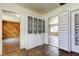 Hallway featuring decorative bi-fold doors and views into adjoining rooms at 1516 Lemon St, Clearwater, FL 33756