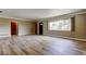 Spacious living area with large window, new flooring, and modern finishes at 1516 Lemon St, Clearwater, FL 33756
