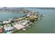 Aerial view of home in a waterfront community showcasing the neighborhood and water access for boating at 17382 Kennedy Dr, North Redington Beach, FL 33708