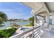 Relaxing back porch overlooking waterfront featuring a spa and an attractive view of the canal at 17382 Kennedy Dr, North Redington Beach, FL 33708