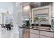 Bright kitchen space with stainless steel appliances and a view of the waterfront dining area at 17382 Kennedy Dr, North Redington Beach, FL 33708
