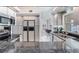 Contemporary kitchen with stainless steel appliances and granite countertops at 17382 Kennedy Dr, North Redington Beach, FL 33708