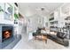 Open floor plan with a fireplace, stairs, and casual dining area at 17382 Kennedy Dr, North Redington Beach, FL 33708