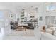 Bright living room with an open floor plan, bar, and casual dining area at 17382 Kennedy Dr, North Redington Beach, FL 33708