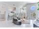Bright living room with high ceilings, bar seating, and water views at 17382 Kennedy Dr, North Redington Beach, FL 33708
