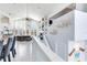 Open-concept living room showing expansive ceilings, staircase, and decorative fish accents at 17382 Kennedy Dr, North Redington Beach, FL 33708
