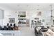Open living space with dining area and wet bar, perfect for entertaining guests, and featuring high ceilings and neutral tones at 17382 Kennedy Dr, North Redington Beach, FL 33708