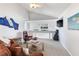 Comfortable living room offering a view to the wet bar with modern decor, lots of natural light, and neutral color palettes at 17382 Kennedy Dr, North Redington Beach, FL 33708
