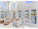 Bright living room featuring french doors with waterfront view at 17382 Kennedy Dr, North Redington Beach, FL 33708