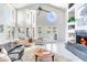 Bright living room featuring a fireplace and french doors to the outside at 17382 Kennedy Dr, North Redington Beach, FL 33708