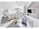 Bright open-concept living room boasts high ceilings, large windows and a view of the water for seamless indoor-outdoor living at 17382 Kennedy Dr, North Redington Beach, FL 33708