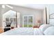 Bedroom with views, a four-poster bed, and a vaulted ceiling at 17382 Kennedy Dr, North Redington Beach, FL 33708