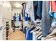 Spacious walk-in closet featuring ample storage with shelving and hanging rods, perfect for organizing any wardrobe at 17382 Kennedy Dr, North Redington Beach, FL 33708
